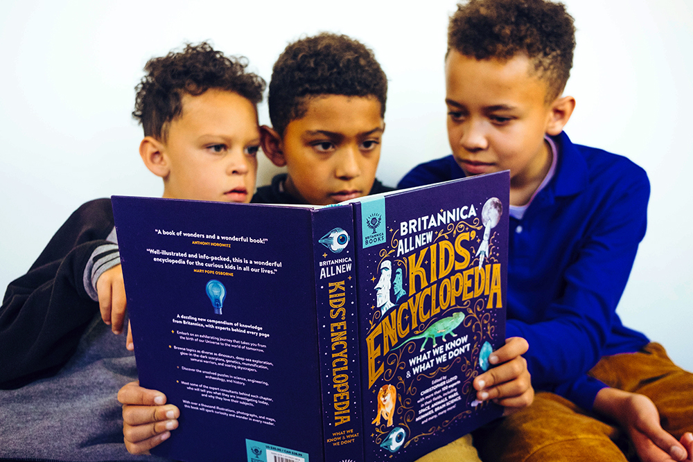 Children reading Britannica All New Kids' Encyclopedia